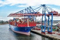 Container ship COSCO SHIPPING GEMINI in the Port of Hamburg Royalty Free Stock Photo