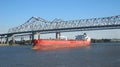 Container Ship Crossing Under the Connection Bridge on the Mississippi River Louisiana. Royalty Free Stock Photo