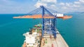 Container ship in export and import business and logistics. Shipping cargo to harbor by crane. Water transport International. Royalty Free Stock Photo