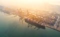 container ship in import export and business logistic, By crane, Trade Port, Shipping, cargo to harbor. Aerial view, Water Royalty Free Stock Photo