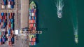 Container ship is loading in a port, Aerial top view container ship