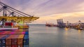 Container ship loading and unloading in deep sea port at sunset, Aerial view of business logistic import and export freight