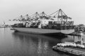 Container ship loading or unloading in port