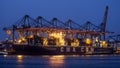 Container ship moored port cranes Royalty Free Stock Photo