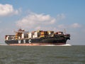 Container ship MSC Adelaide on Westerschelde in the Netherlands to port of Antwerp, Belgium Royalty Free Stock Photo