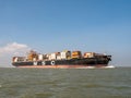 Container ship MSC Adelaide on Westerschelde in the Netherlands to port of Antwerp, Belgium Royalty Free Stock Photo