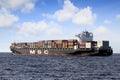 Big container ship of MSC Company sailing in open waters.