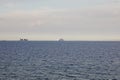 A container ship and a passenger ferry on the sea