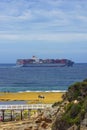 Container ship with people nearby in Victoria, Australia.