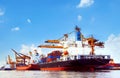 Container ship in port cargo dock with piers crane tool use for Royalty Free Stock Photo