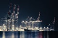 container ship and port cranes Royalty Free Stock Photo