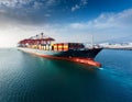 Container ship in port terminal - huge freighter fully loaded Royalty Free Stock Photo