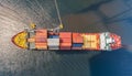 Container ship in port terminal - huge freighter fully loaded