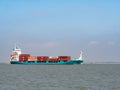 Container ship Ragna on Westerschelde in the Netherlands to port of Antwerp, Belgium Royalty Free Stock Photo