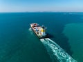container ship sailing full speed with beautiful wave pattern line, cargo logistic and transportation import export of Royalty Free Stock Photo