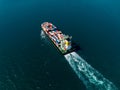 container ship sailing full speed with beautiful wave pattern line, cargo logistic and transportation import export of Royalty Free Stock Photo