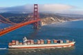 Container ship under Golden Gate bridge Royalty Free Stock Photo