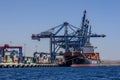 A container ship unloads it cargo at the Aqaba Container Terminal on the Gulf of Aqaba in Jordan.