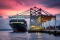 Container ship unloads cargo at bustling commercial dock during twilight
