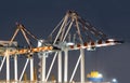 Container Ships Being Unloaded At Night.