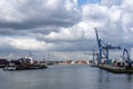 Container ships moored at a container terminal in the Port of Rotterdam. The port is the Europ`s largest and facilitate the needs