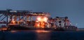 Container ships at wharf panorama at night