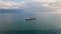 Container tanker floating at endless ocean drone view. Cargo ship moving in sea Royalty Free Stock Photo