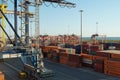 Container terminal with stowed containers from different shippers gantry cranes and straddle carriers in Livorno. Royalty Free Stock Photo