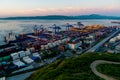 Container terminal in Vladivostkoye against the background of the sea.