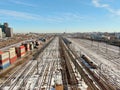 Container transport by rail. Aerial view panorama of a major railway station in the big city.