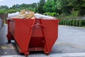Container trash dumpster is used for recycling of construction waste in a caring environment with solid household waste Royalty Free Stock Photo
