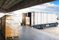 Container Trucks Parked Loading Package Boxes Pallets at Warehouse Dock. Warehouse Shipping, Supplies, Freight Truck Logistic Royalty Free Stock Photo