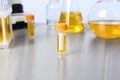 Container with urine sample for analysis on table Royalty Free Stock Photo