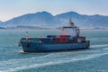 Container vessel passes underway along Gwangyang bay shore Royalty Free Stock Photo