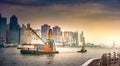 Container vessel and a small tug boat - mooring operations in Hong Kong Royalty Free Stock Photo