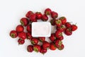Container with yogurt and a pile of fresh strawberries on white Royalty Free Stock Photo