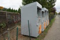 Containers for collecting old clothes and shoes are located on the street. Berlin, Germany Royalty Free Stock Photo