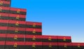 Containers with flag of Angola represent declining trend. Economic or export crisis concept. 3D rendering