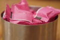 Containers hold pink sugar packets in a cafe Royalty Free Stock Photo