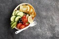 Containers for the preparation of healthy food with brown rice, fried cheese halumi, tomatoes, cucumbers, pine nuts. Top Royalty Free Stock Photo