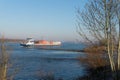 Containership on the river the Waal in the Netherlands