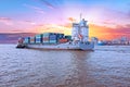 Containership on the Yangon river near Yangon in Myanmar at suns Royalty Free Stock Photo