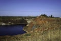 Contaminated pond lake of an old abandoned mining landscape for copper mining with red earth