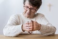 Contemplating elderly woman with rosary Royalty Free Stock Photo