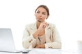 Contemplating new ideas. A thoughtful young businesswoman sitting with pen in hand at her desk isolated on white. Royalty Free Stock Photo