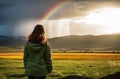 Contemplating rainbow over prairie Royalty Free Stock Photo