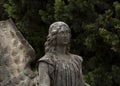 Contemplative angel with broken wing Royalty Free Stock Photo