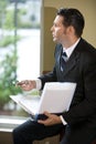 Contemplative businessman looking out window Royalty Free Stock Photo