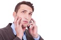 Contemplative businessman talking on phone