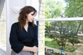 Contemplative businesswoman looking out the window Royalty Free Stock Photo